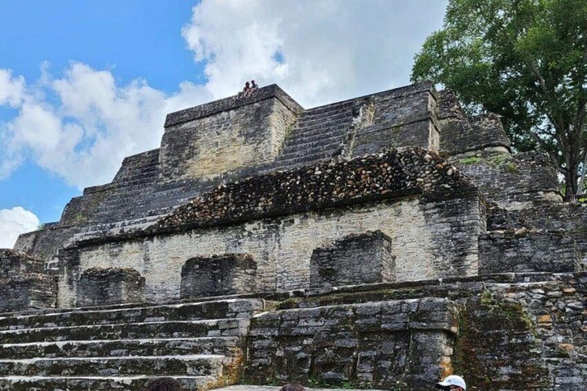 An ancient stone structure with steps leading up to a platform. 5