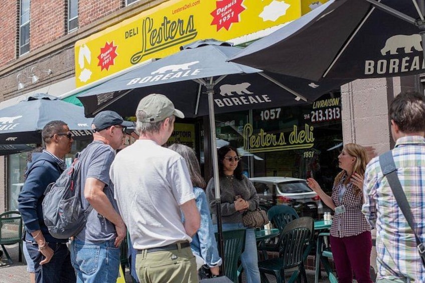 Outdoor seating at a deli with a sign reading 'Peters deli' and 'Boreale.' 4