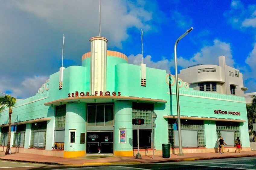 A teal and white theater with 'SENOR FROGS' signage. 4