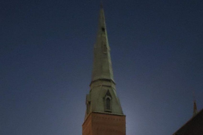 A church steeple against a clear sky. 2