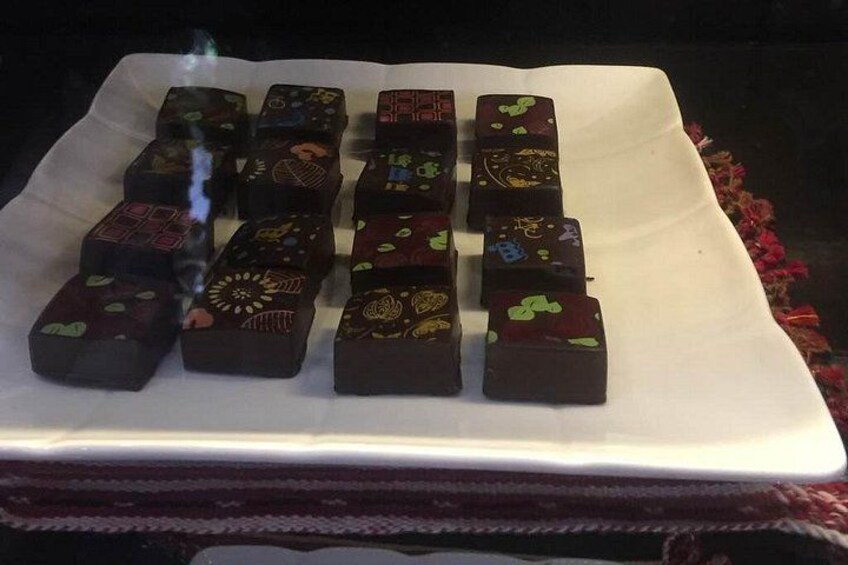 A white plate with variously decorated chocolate blocks. 3