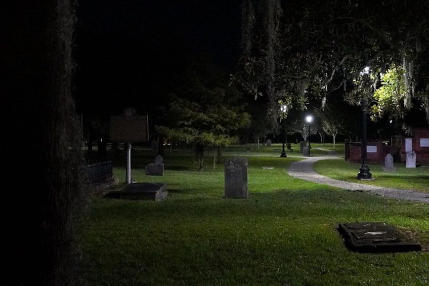 Enlarge and look between the Historic Marker on the left and the tombstone. 3
