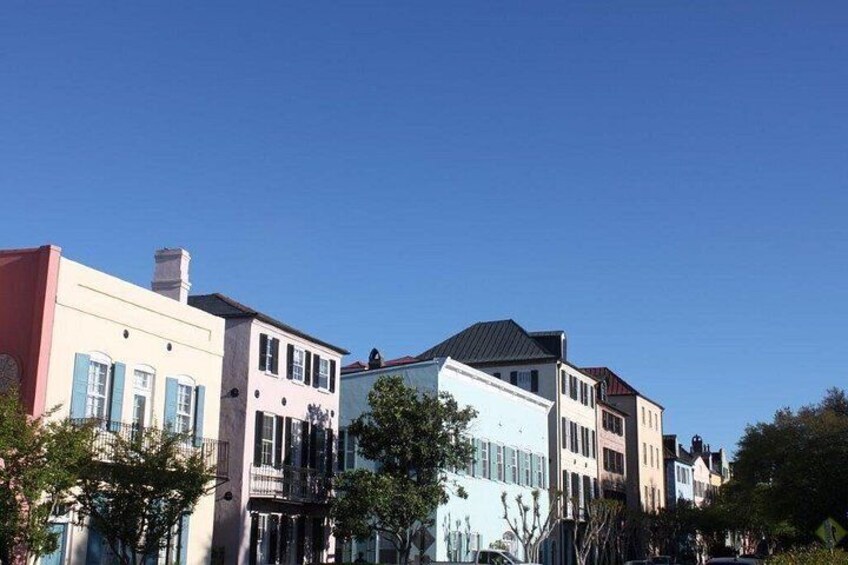 A row of colorful houses with a clear blue sky. 4