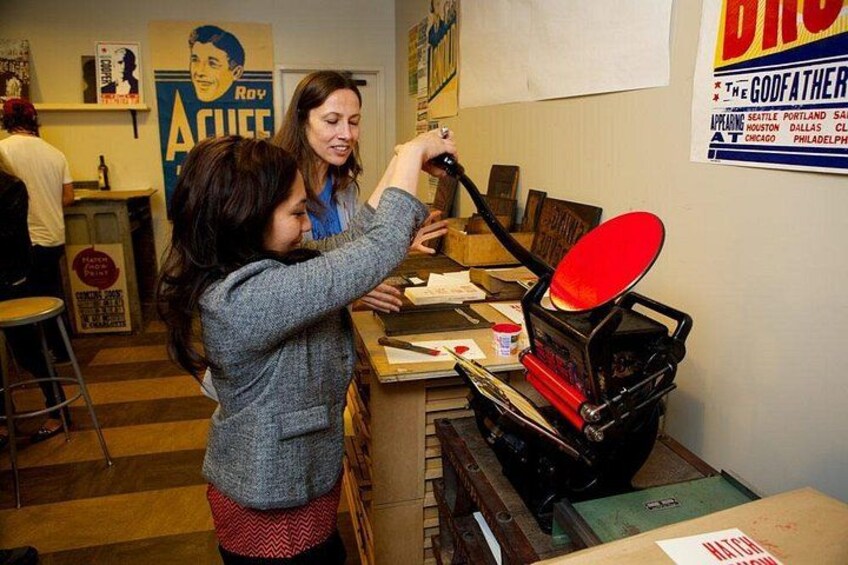 A person using a red frying pan on a stove. 4