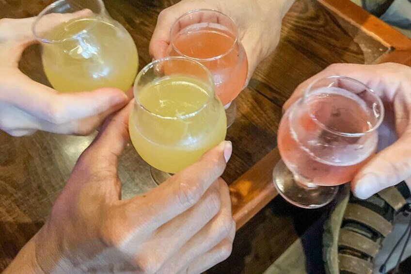 A group of people holding glasses of beverages. 2