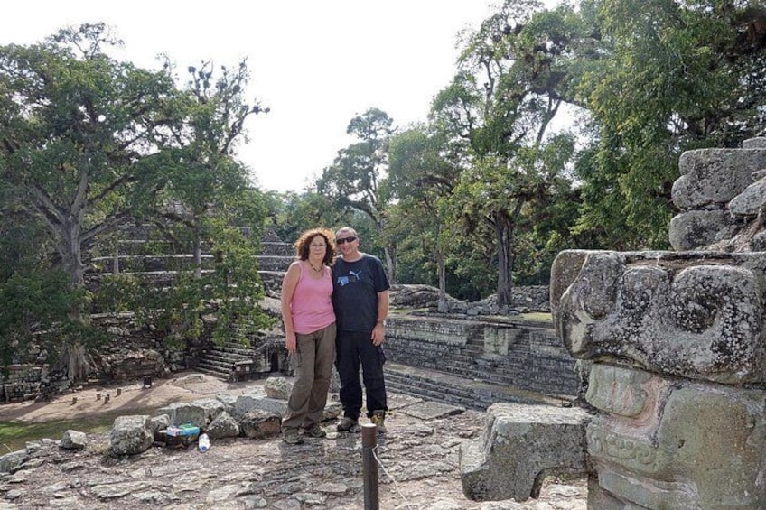 A historical site with stone ruins and trees. 3