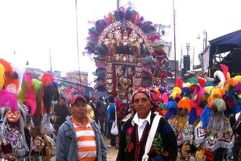 A colorful parade with a large, ornate float and people in vibrant costumes. 5
