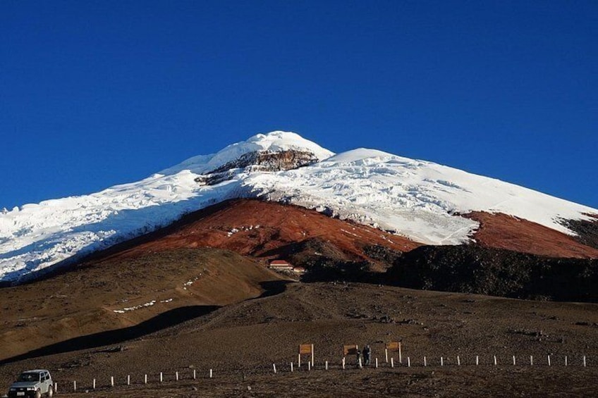 A snow-capped mountain with a clear sky. 2