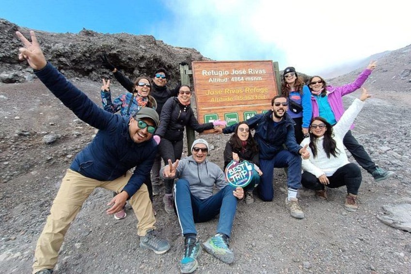 A group of people posing with a sign at Refuge José Rivas. 2