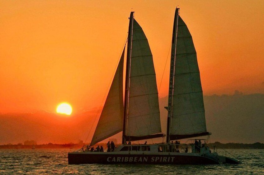 A sailboat named Caribbean Spirit sailing at sunset. 2