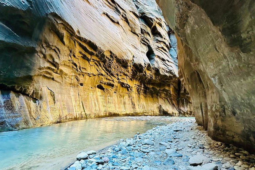 A river flowing through a canyon with rocky terrain and steep canyon walls. 3