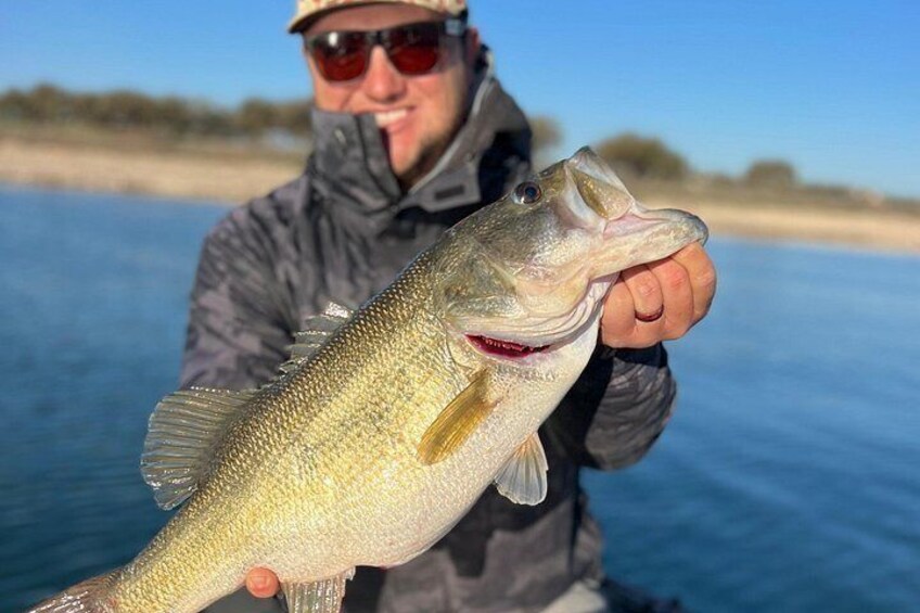 A person holding a fish. 2