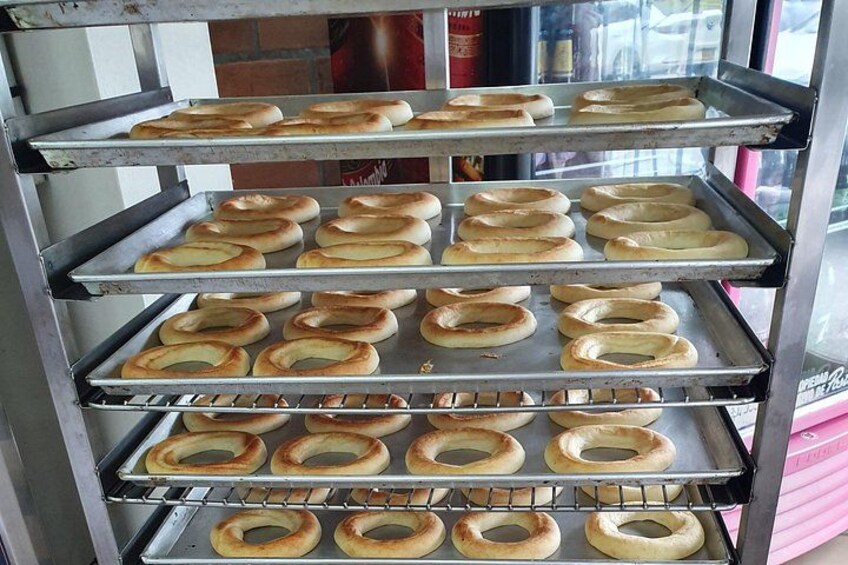 A rack of freshly baked bagels. 4