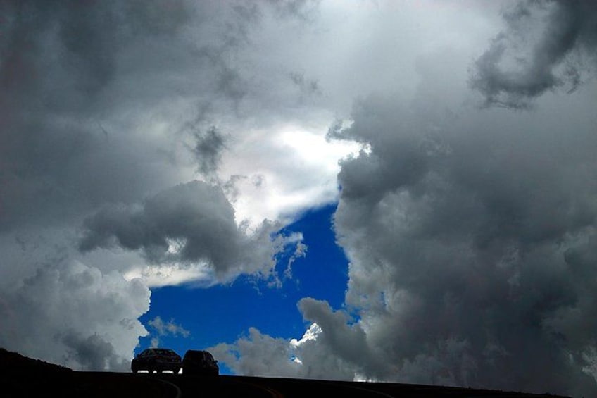 A landscape with a blue sky and clouds. 3