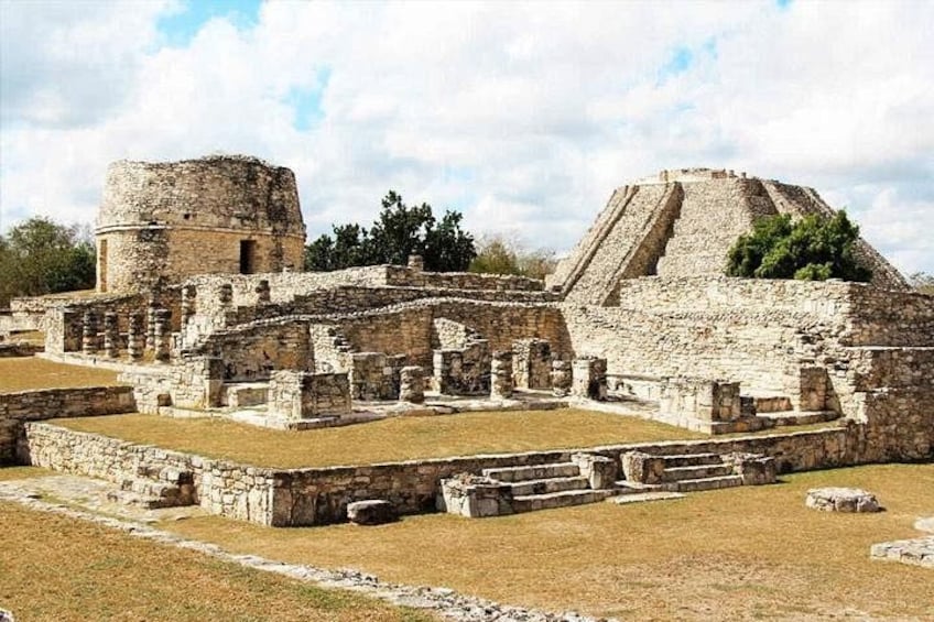Ancient ruins with a large pyramid and a circular structure. 2