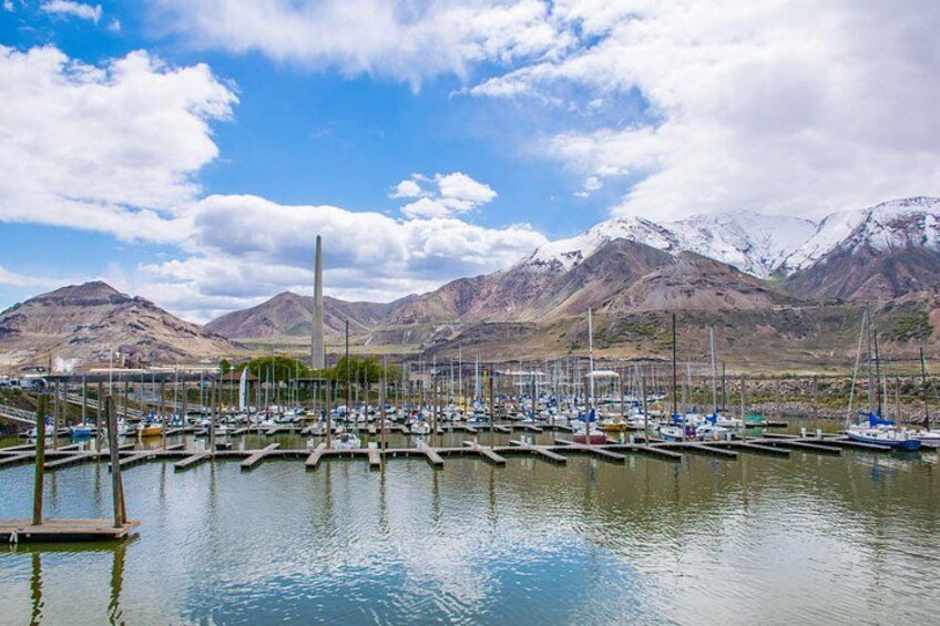 A lake in the desert surrounded by Rocky Mountains 4