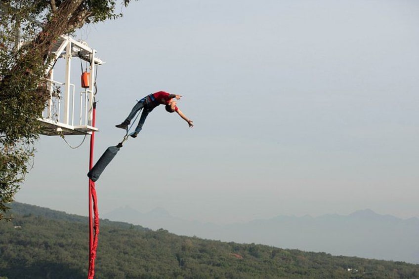 A person bungee jumping from a tower. 5