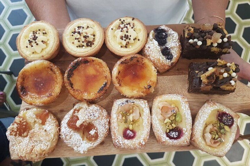 A variety of pastries on a wooden board. 2