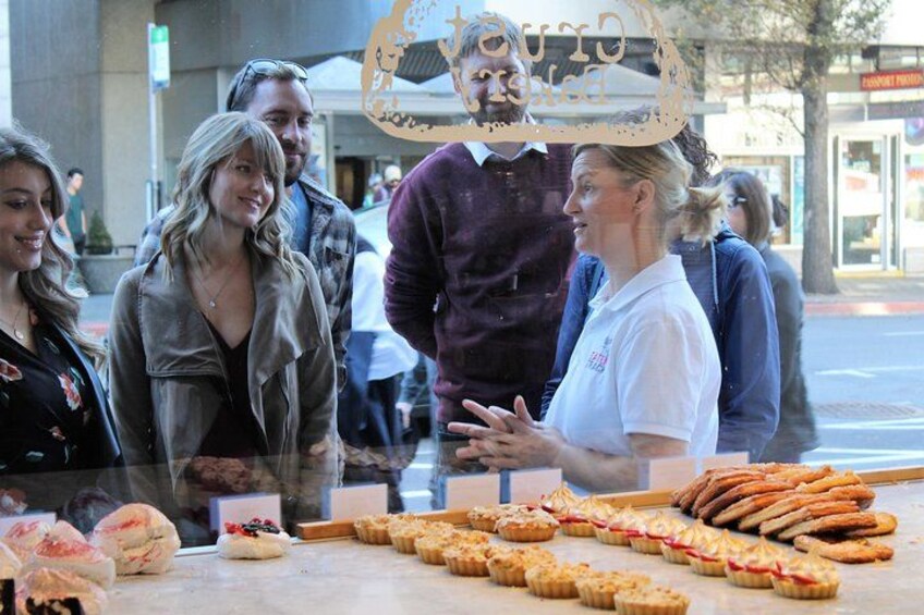 A street vendor selling pastries and cookies. 1