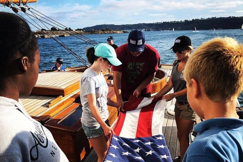 Kids folding the American Flag 2