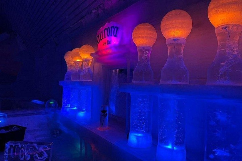 Illuminated ice sculptures with a neon sign. 2