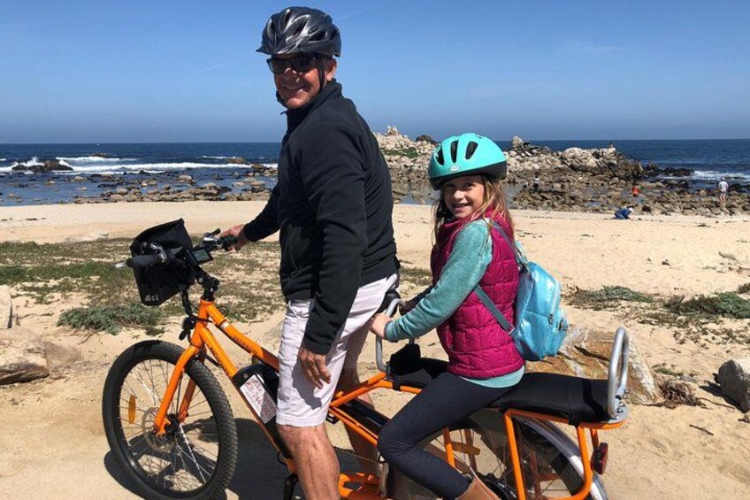 Tandem-style eBiking on the 17 Mile Drive tour, ideal for parents with young riders along the scenic Monterey coast 3
