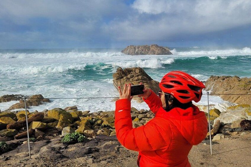 Guest capturing the crashing waves at Bird Rock, a dramatic photo stop on our 17 Mile Drive eBike Tour through Pebble Beach 3