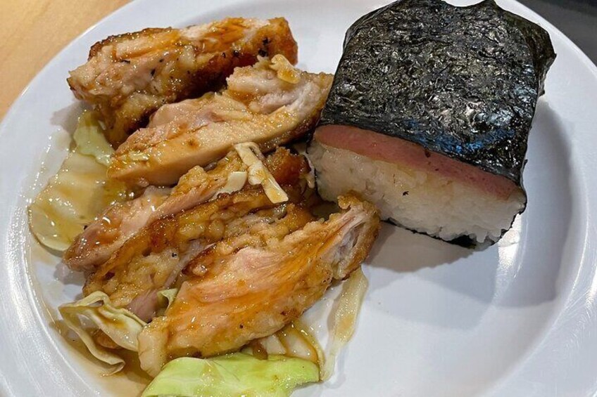 A plate with sliced chicken, a piece of fish, and some vegetables. 3