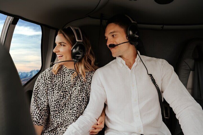Two people in a car wearing headsets. 1