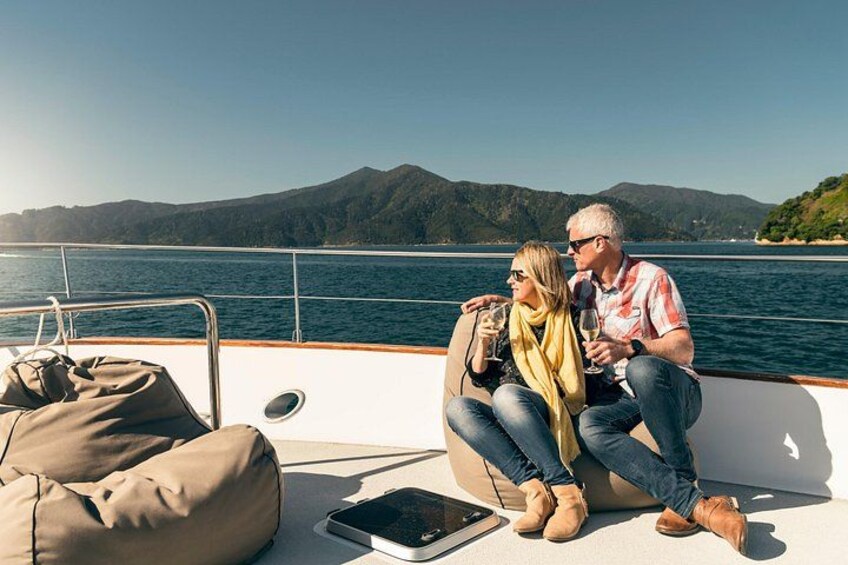 Couple on board boat in Marlborough Sounds with wine 3
