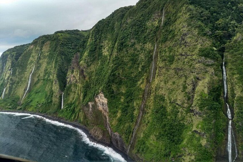Fly by stunning sea cliff waterfalls as you experience flight by choosing the GREEN Sky-Road to Hana route! 2