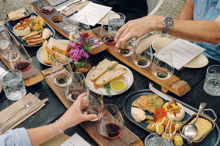 A dining table with various dishes, glasses, and cutlery. 2