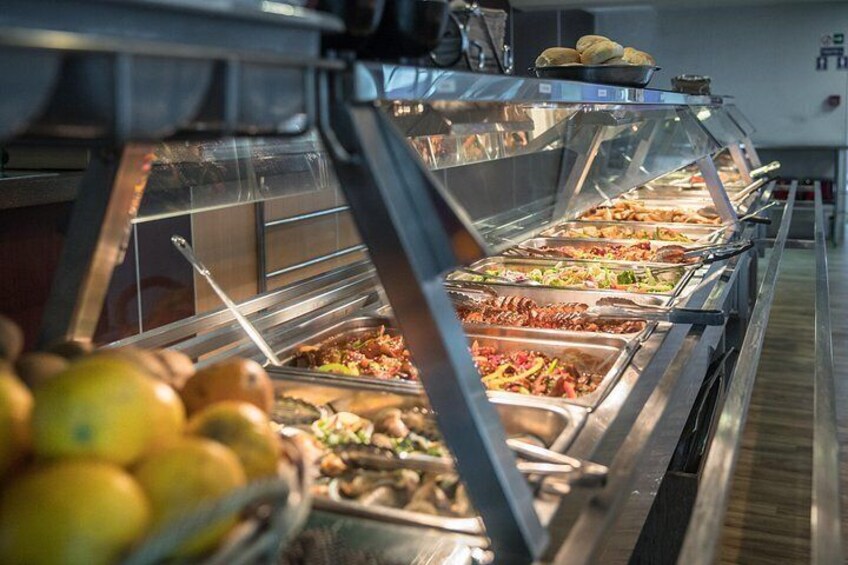 A buffet with various food items in metal containers. 2