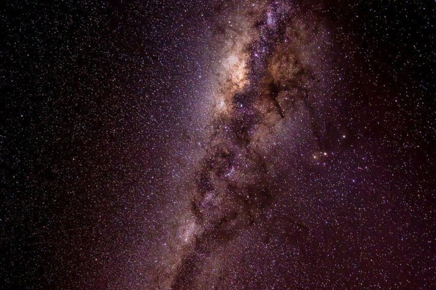 A starry night sky with a prominent galaxy. 4