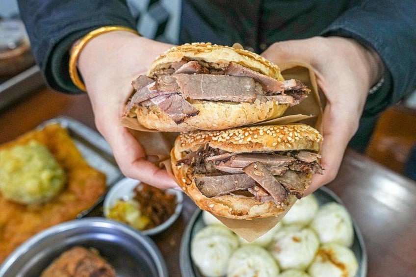 Discover Beijing comfort food with Mr. Yu’s crispy sesame flatbread stuffed with cured beef and a warm bowl of tofu pudding – nostalgic flavors that never go out of style. 3