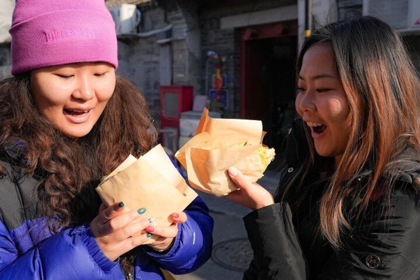 Try jianbing with a twist at this hole-in-the-wall spot, where a classic mung bean wrap meets a cheesy upgrade—blending tradition with tasty innovation. 4
