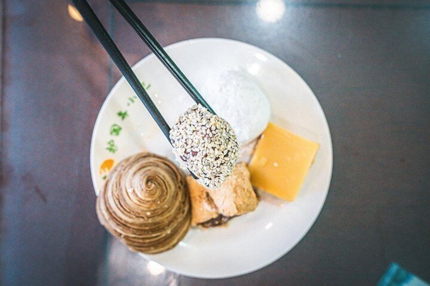Taste Beijing’s imperial treats at this 80-year-old shop, serving up pea jelly, donkey rolls, and tangy hawthorn cake—sweets once savored by emperors. 2