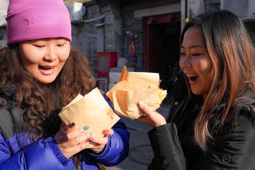Try jianbing with a twist at this hole-in-the-wall spot, where a classic mung bean wrap meets a cheesy upgrade—blending tradition with tasty innovation. 2