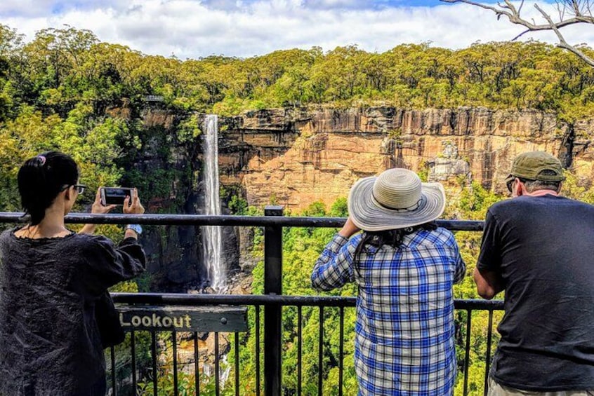 Witness a towering waterfall plunging over sandstone cliffs 5