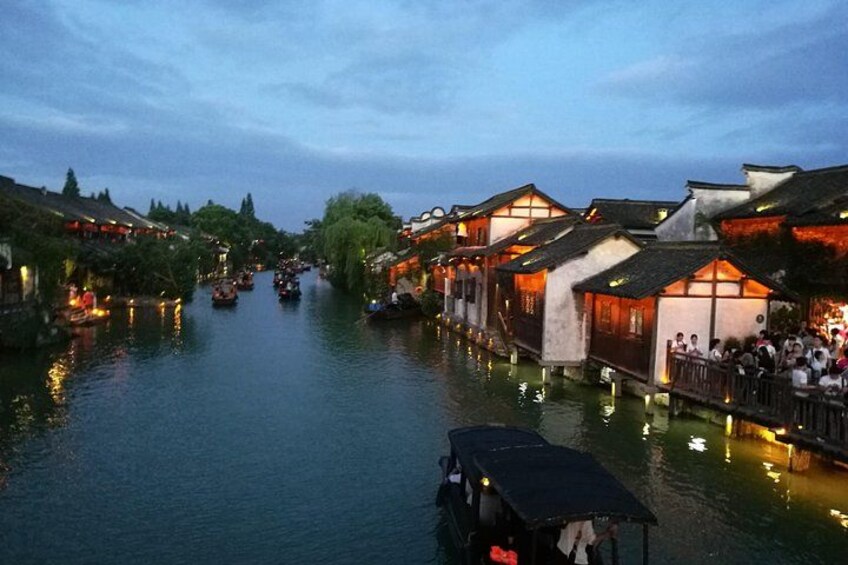 A river with traditional buildings and boats. 3