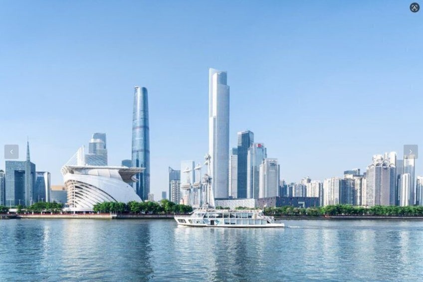 A city skyline with modern skyscrapers and a boat on the water. 4