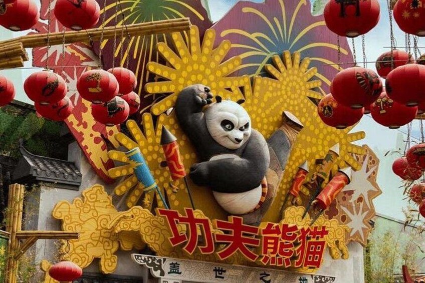 A panda statue with Chinese characters, surrounded by red lanterns and traditional Chinese decorations. 2