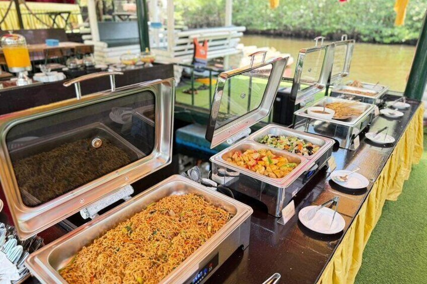 A buffet table with various food items. 2