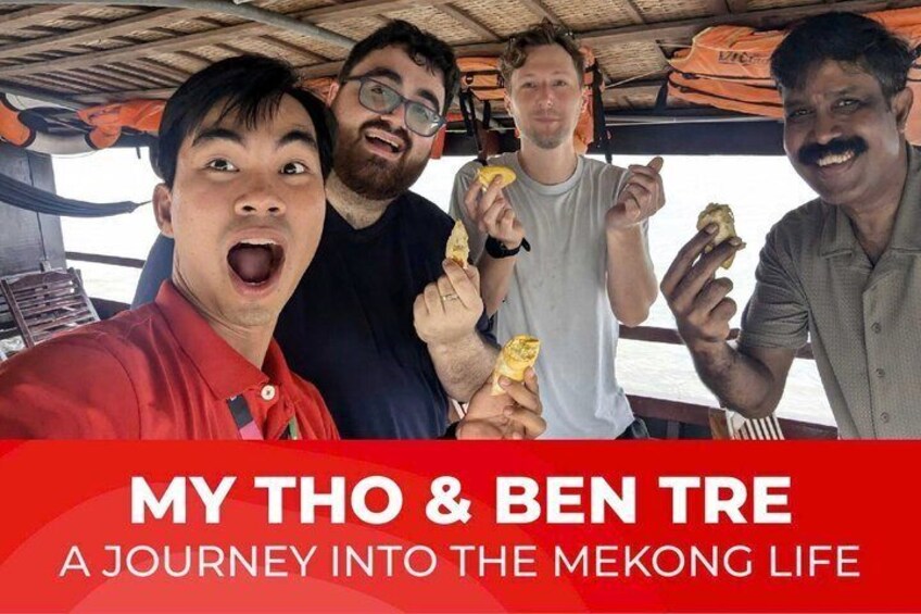 Four people on a boat, holding food items. 1