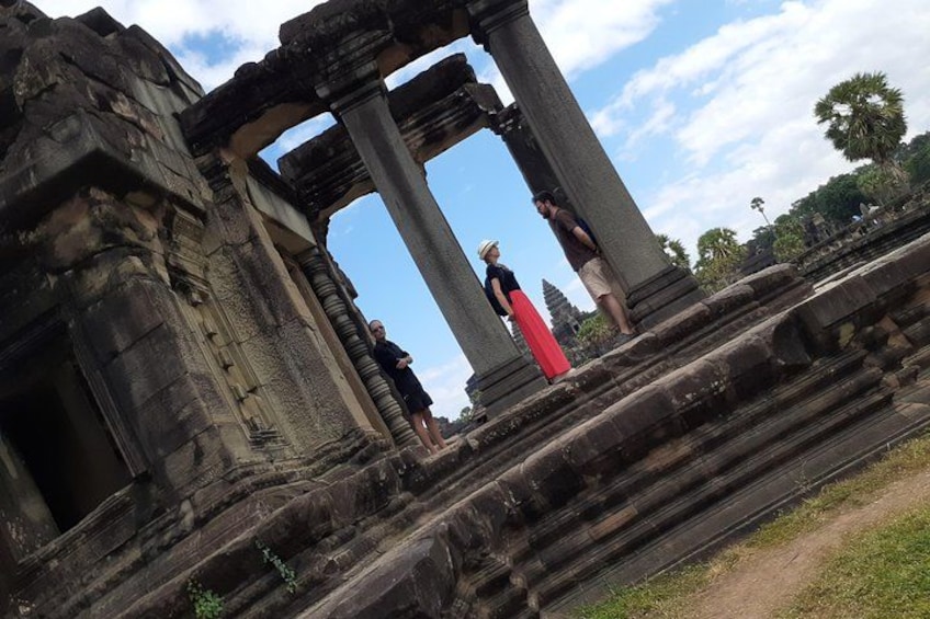 Ancient stone ruins with columns and a partially intact structure. 2