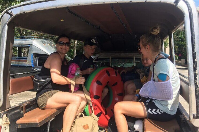 People in a van with a life preserver in the back. 5