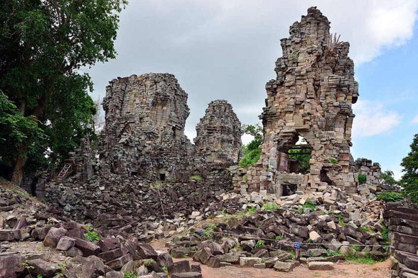 Ancient stone ruins with overgrown vegetation. 3