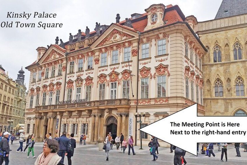 Kinsky Palace in Old Town Square with people walking around. 2