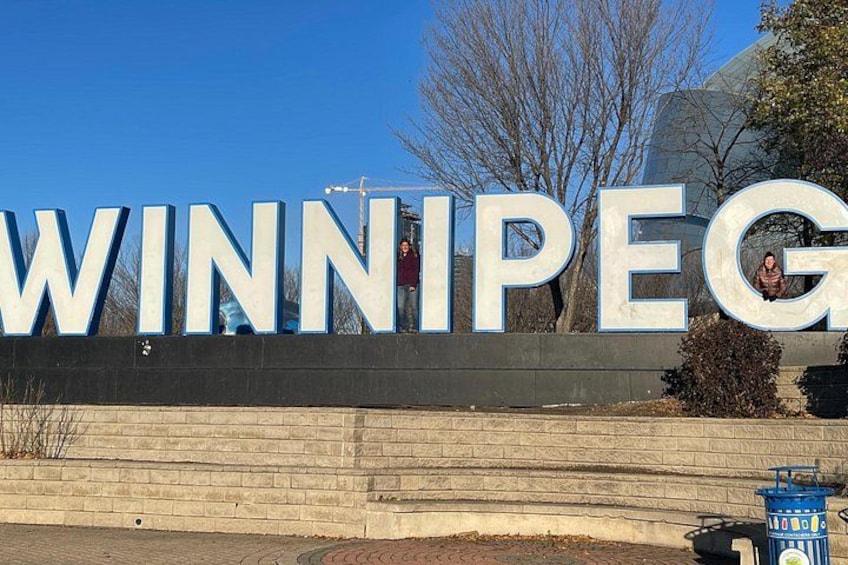 A large sign with the word 'WINNIPEG' in capital letters. 3