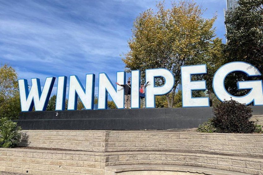 A large sign with the word 'WINNIPEG' in capital letters. 2